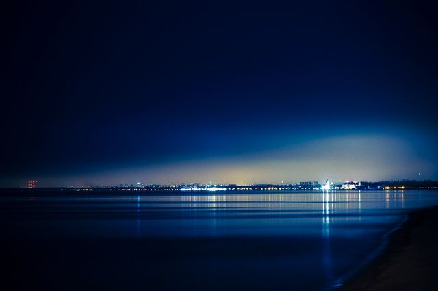 Tranquil Night Cityscape Over Calm Water Reflections - Download Free Stock Photos Pikwizard.com