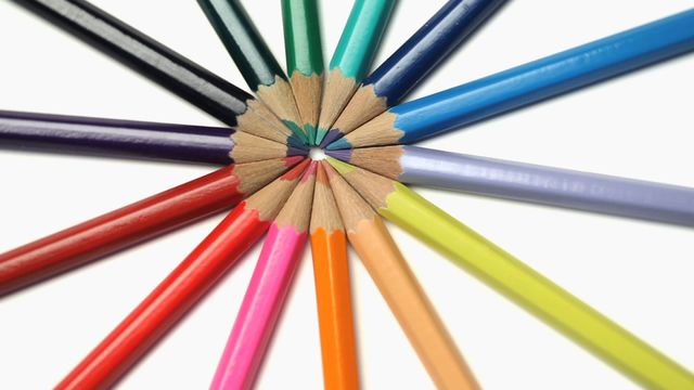 Colorful pencils are neatly arranged to form a mandala design with their tips meeting at the center against a white background. This video is perfect for promoting creativity, educational materials, and art supplies. It can be used in school-related projects, artistic event advertisements, crafting ideas, or as a decorative element in educational and artistic contexts.