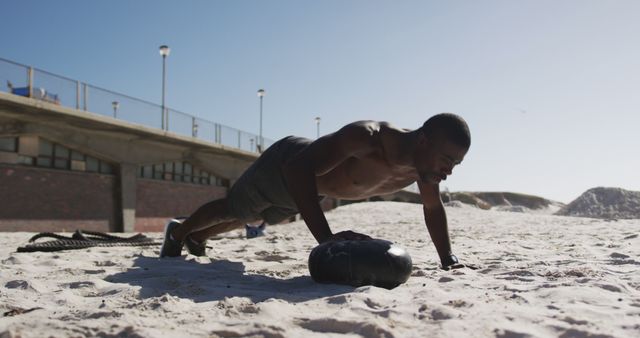 Man Performing Outdoor Push-Ups on Sandy Beach - Download Free Stock Images Pikwizard.com