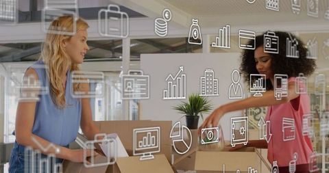 Two women packing boxes in modern coworking space with digital business icons overlay