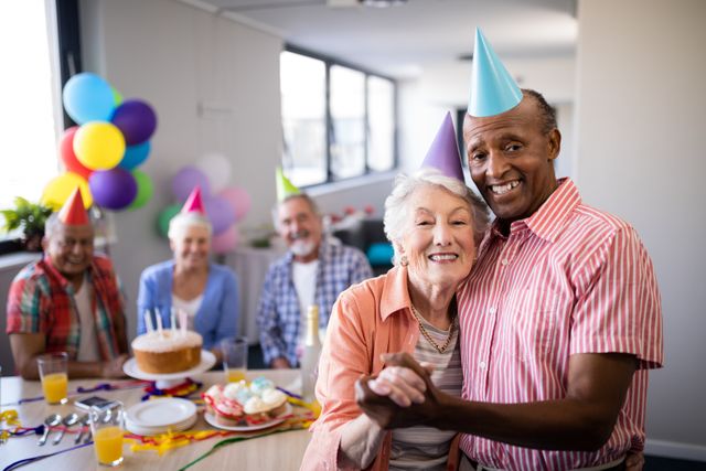 Senior Couple Celebrating Birthday with Friends - Download Free Stock Photos Pikwizard.com