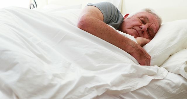 Senior man sleeping in the bedroom at home 
