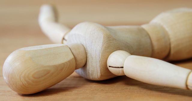 Artistic Wooden Mannequin Lying on Wooden Surface - Download Free Stock Images Pikwizard.com