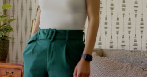 Woman relaxing with smartphone in modern home environment