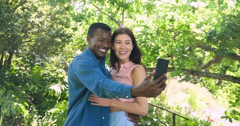 Happy Couple Taking Selfie in Sunny Garden