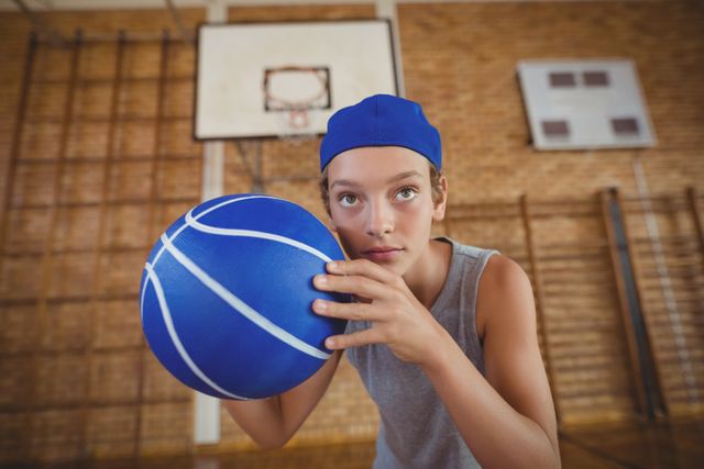 High school boy playing basketball in the court - Download Free Stock Photos Pikwizard.com