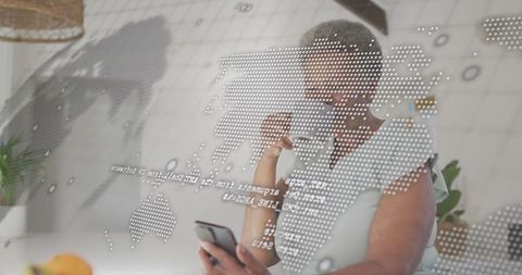 Woman Analyzing Digital World Map Projection in Cozy Home Kitchen