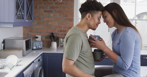 Relaxed Couple Enjoying Coffee Together in Modern Kitchen - Download Free Stock Images Pikwizard.com