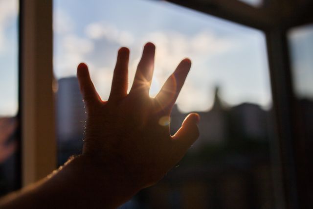Hand Reaching Towards Sunlight Through Window - Download Free Stock Photos Pikwizard.com