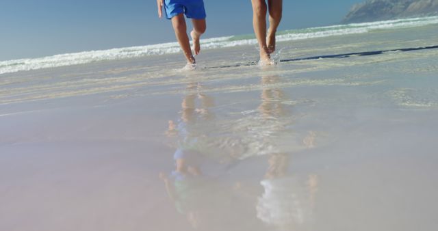 People Running on Beach with Clear Ocean Water - Download Free Stock Images Pikwizard.com