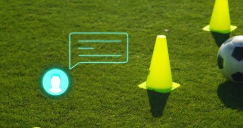 Soccer Training Equipment on Grass Pitch Highlighted by Digital Icons