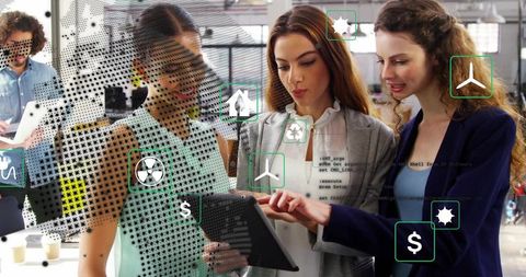 Team Analyzing Tablet with Green Digital Icons in Office