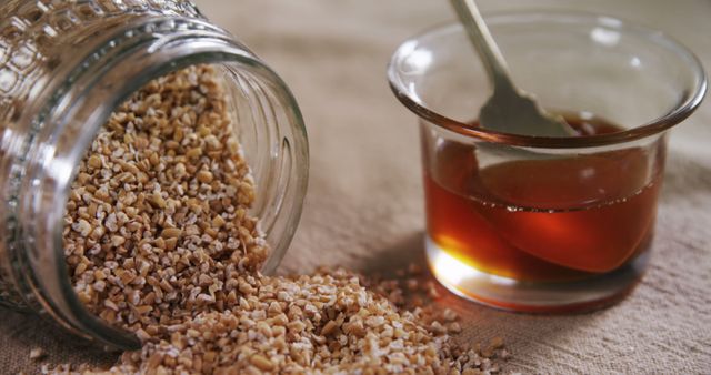 Steel Cut Oats Spilled from Jar with Honey in Glass - Download Free Stock Images Pikwizard.com