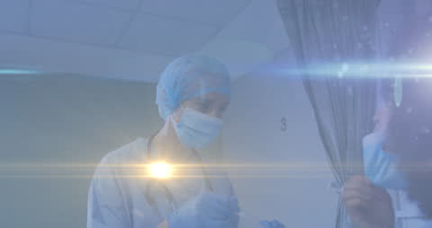 Healthcare Workers in Action with Light Effects Inside Hospital