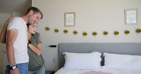 Joyful couple celebrating special occasion at home