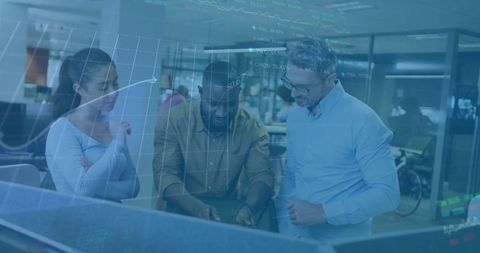 Diverse business team analyzing financial data in modern office environment
