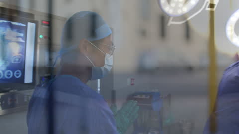 Surgeon in Operating Room with Surgical Gloves Preparing for Procedure
