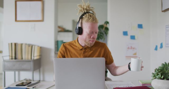 Man with Headphones Working at Home Office Desk - Download Free Stock Images Pikwizard.com