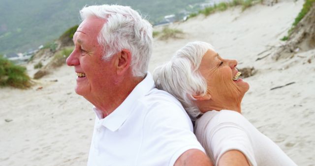 Happy Senior Couple Laughing on Beach - Download Free Stock Images Pikwizard.com