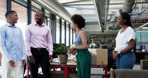 Colleagues Welcoming New Team Member in Modern Office