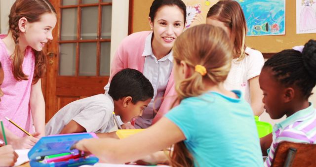 Teacher engaging with young students in a colorful classroom environment. Ideal for education websites, classroom management resources, and promotional materials for schools and educational programs.