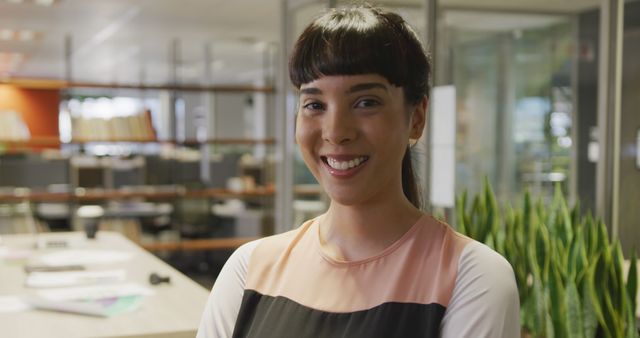 Confident Woman Smiling in Modern Office Environment - Download Free Stock Images Pikwizard.com