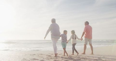 Grandparents and Grandchildren Strolling Beach at Sunset - Download Free Stock Images Pikwizard.com