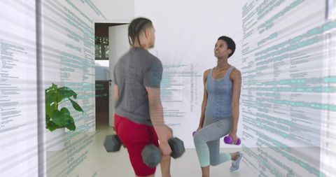 Couple doing weighted lunges with holographic code overlay for modern home fitness