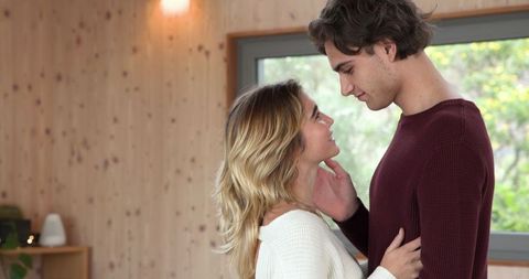 Romantic Couple Gazing in Cozy Living Room Interior