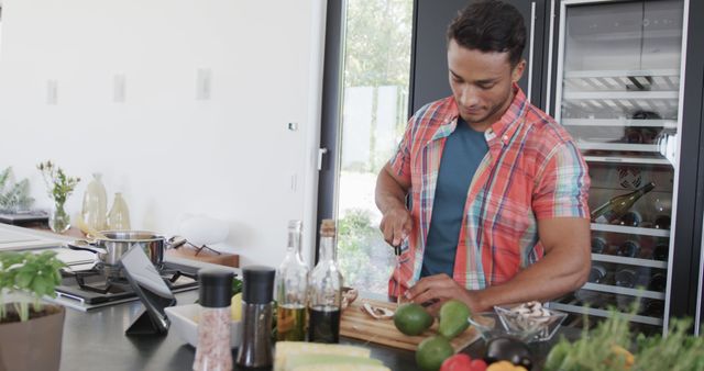 Young Man Chopping Vegetables in Modern Kitchen - Download Free Stock Images Pikwizard.com