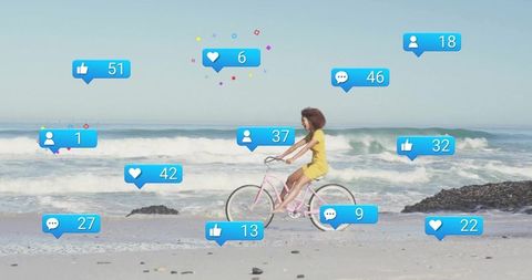 Woman Cycling On Beach With Floating Social Media Icons