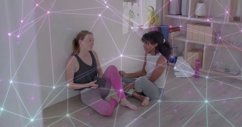 Diverse Friends Discussing Yoga with Digital Network Overlay
