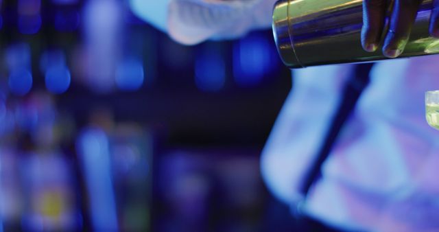 Bartender Mixing Cocktails in Nightclub with Blue Lighting - Download Free Stock Images Pikwizard.com