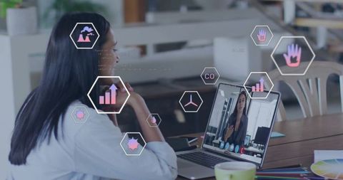 Woman Having Video Call Meeting With Virtual Graphic Icons Overlay