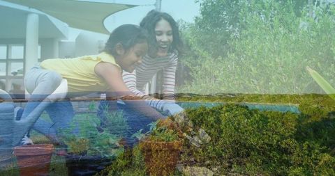 Mother and Daughter Enjoy Outdoor Gardening Together