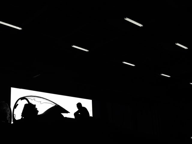 Silhouette of Aircraft Technician in Hangar Under Dramatic Lighting - Download Free Stock Images Pikwizard.com