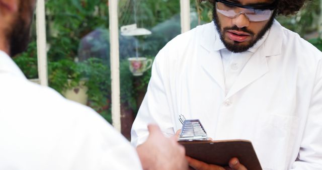 Focused Researchers Analyzing Data in Botanical Laboratory - Download Free Stock Images Pikwizard.com