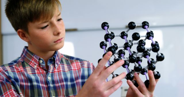 Child Examining Molecular Structure Model in Classroom - Download Free Stock Images Pikwizard.com