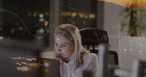 Businesswoman Analyzing Financial Data in Corporate Office at Night