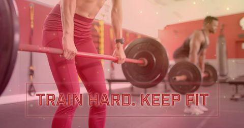 Diverse Individuals Lifting Weights at Gym for Fitness