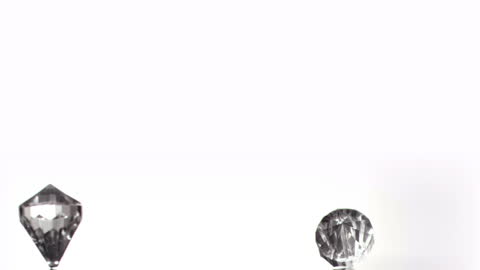 Sparkling Diamonds Rotating Against Clean White Background