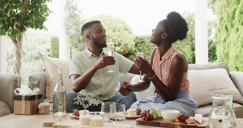 Romantic Celebration of African American Couple on Sunny Patio