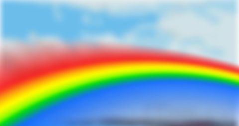 Vibrant rainbow across a cloudy sky