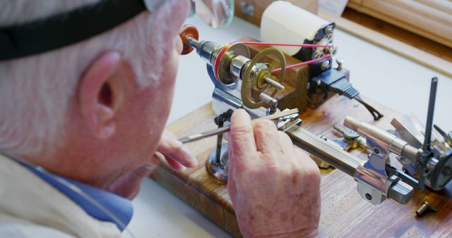 Senior Man Operating Precision Watchmaker Lathe Machine at Workshop - Download Free Stock Images Pikwizard.com