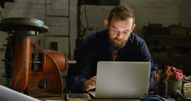 Mechanical Engineer Using Laptop in Workshop Setting - Download Free Stock Images Pikwizard.com