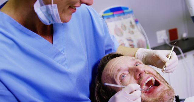 Close-up of Dentist Treating Male Patient's Teeth - Download Free Stock Images Pikwizard.com