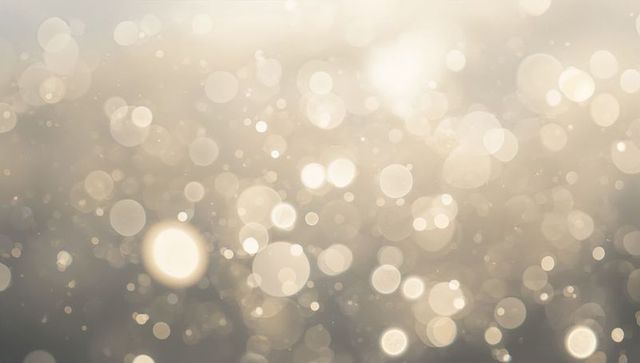 Shimmering champagne bokeh background with warm golden orbs and soft sparkling glow