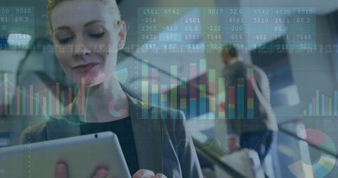 Multiracial Business Team Analyzing Digital Financial Data on Tablets