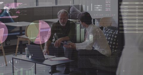 Diverse Business Pair Analyzing Digital Data Overlay