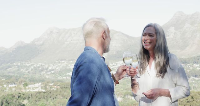 Happy Mature Couple Enjoying Drinks Outdoors with Scenic Mountain View - Download Free Stock Images Pikwizard.com